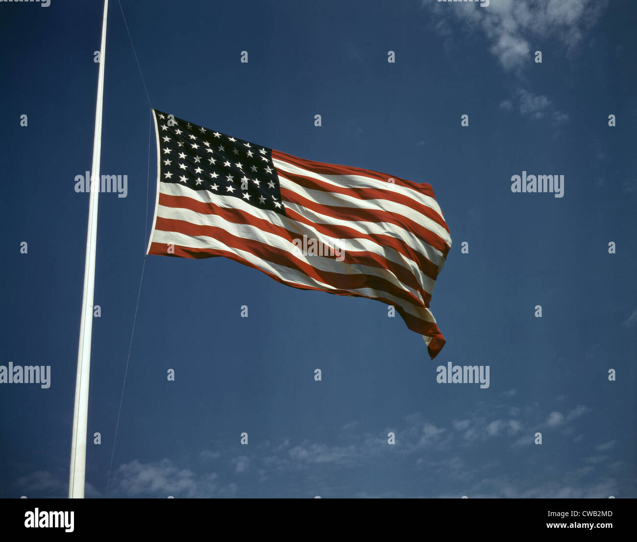 World War II, American flag, original caption: 'High above, over a true 'home of the brave,' the floating folds of the Star Stock Photo