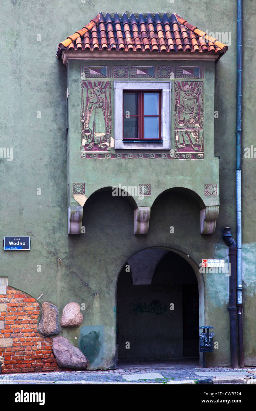A medieval oriel or bay window in a side street off the old town square, Stary Rynek, in the Polish city of Poznan, Poland Stock Photo