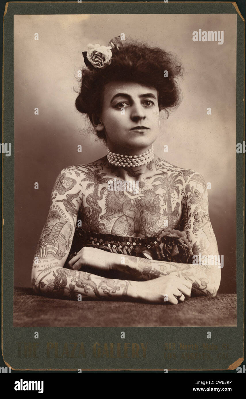 Portrait of a woman showing images tattooed on her body, the Plaza Gallery, Los Angeles, California, 1907. Stock Photo