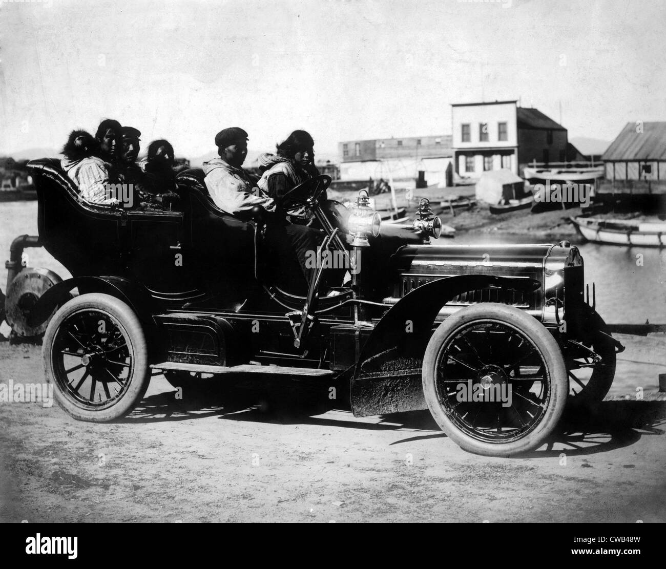 Cars. Eskimos, five adults and one infant, sitting in an automobile, Oct 5, 1906 Stock Photo