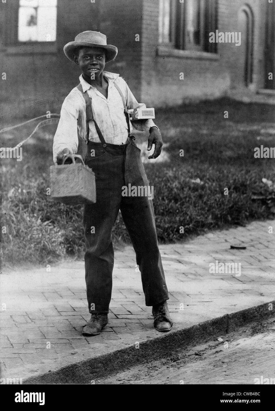 Portrait of an African American man with a shoeshine box, titled: 'Shine sah?', photograph 1899. Stock Photo