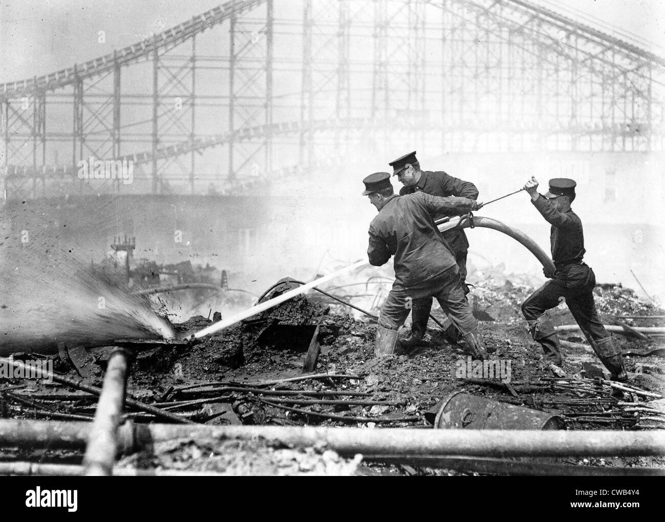 Coney Island, the Dreamland fire, men extinguishing the fire at Dreamland, roller coaster in background, Coney Island, New Stock Photo