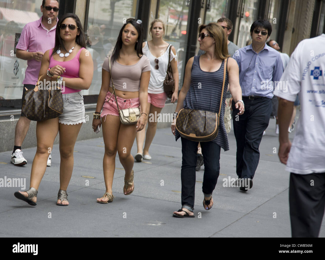 Three women window shopping on 5th Avenue in Manhattan. Stock Photo