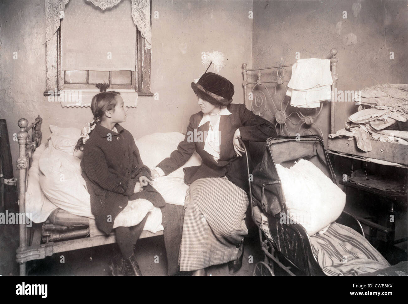 Sick child in New York City, from original caption: 'Investigator talking with Ida List, 124 Ridge Street, New York. 8 year old Stock Photo
