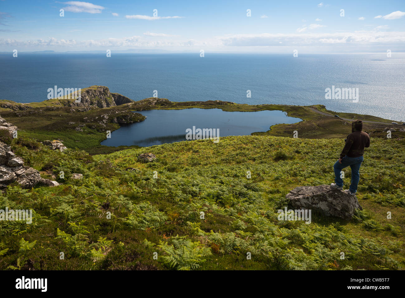 A scenic lake at the Slieve League cliffs with the Atlantic beyond, on the west coast of Donegal, Republic of Ireland. Stock Photo