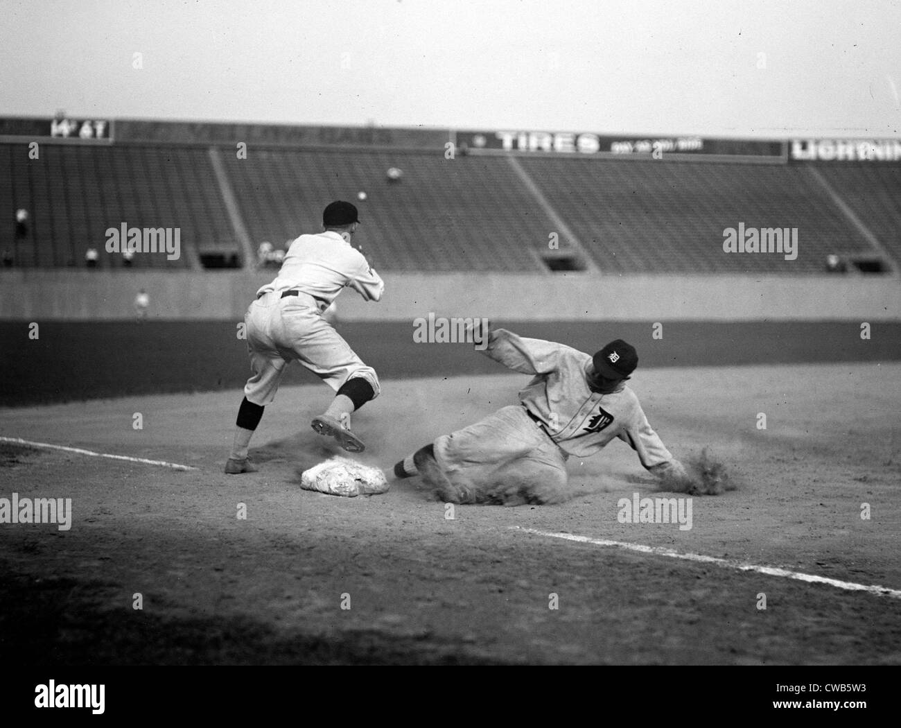 Baseball. Ty Cobb safe at third after making a triple. August 16, 1924 Stock Photo