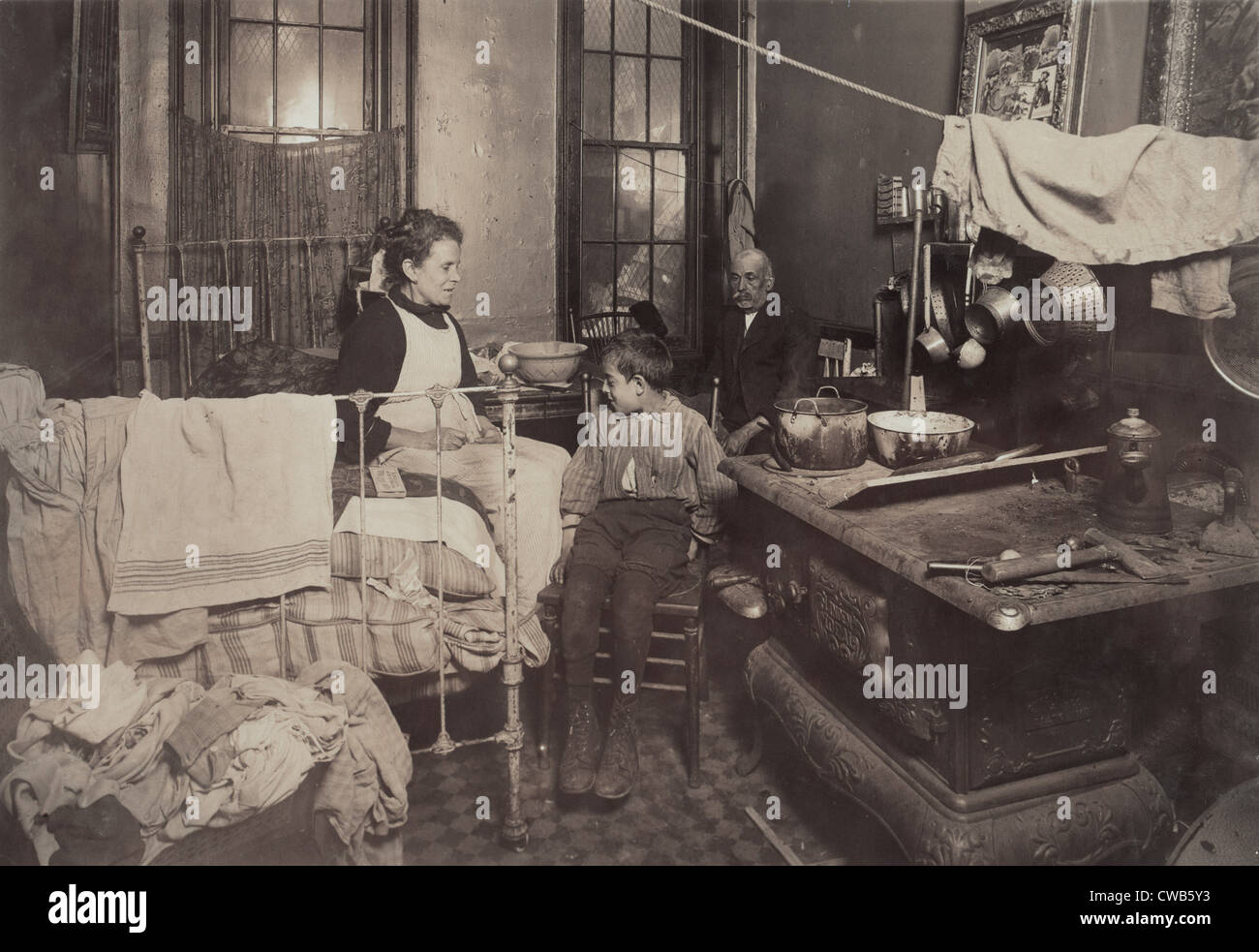 Child abuse, from caption: 'Jimmie Chinquanana, 11 Hamilton Street, In dark, inner room of his home, in the rear of their Stock Photo