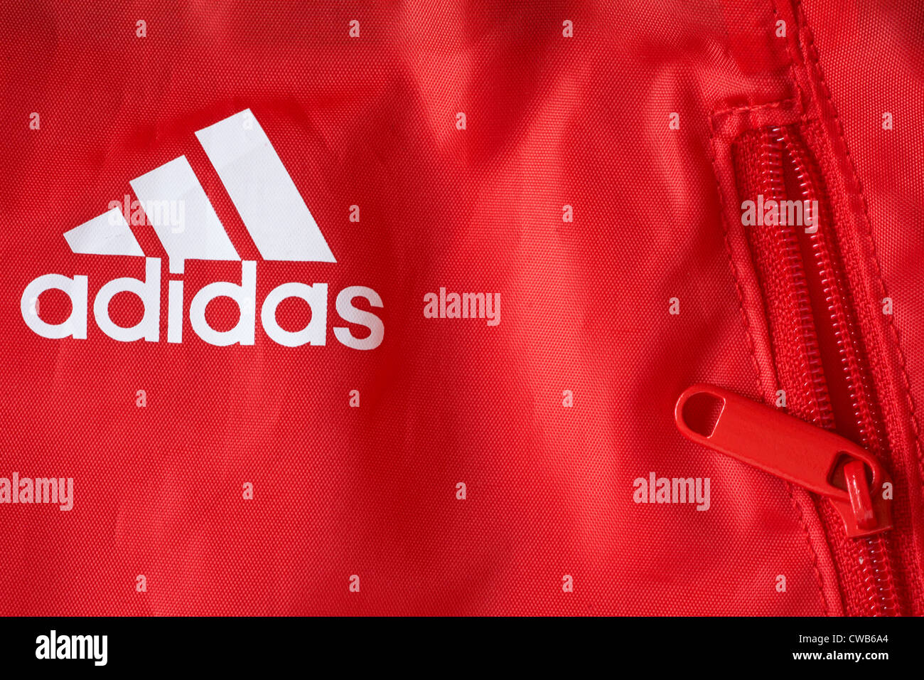 adidas logo and red zip zipper on Adidas drawstring bag Stock Photo - Alamy