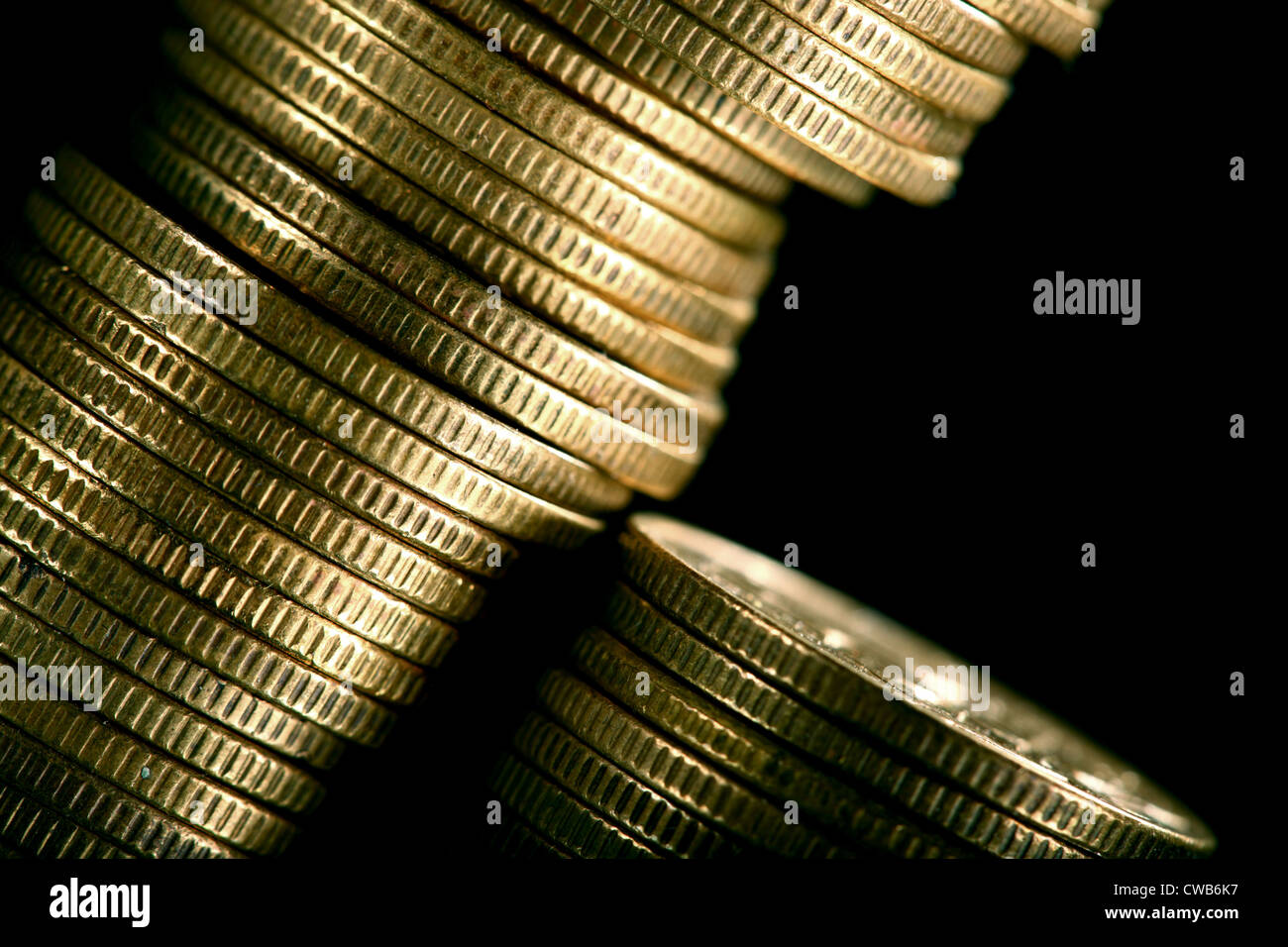 golden coins on black background Stock Photo - Alamy