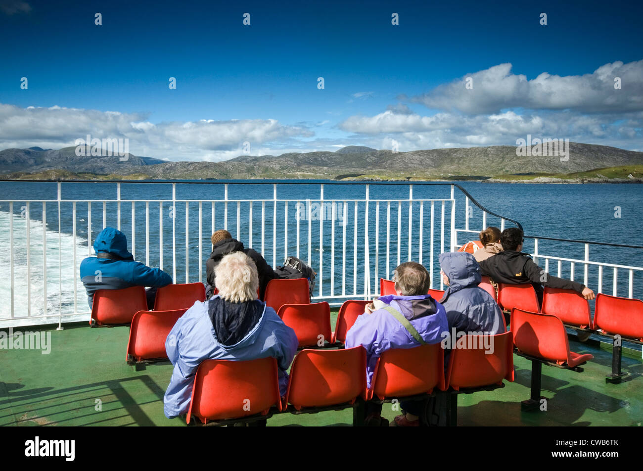 Passengers on the Tarbert to Uig (Isle of Skye) ferry leaving the port of Tarbert on the Isle of Harris in Scotland, UK Stock Photo