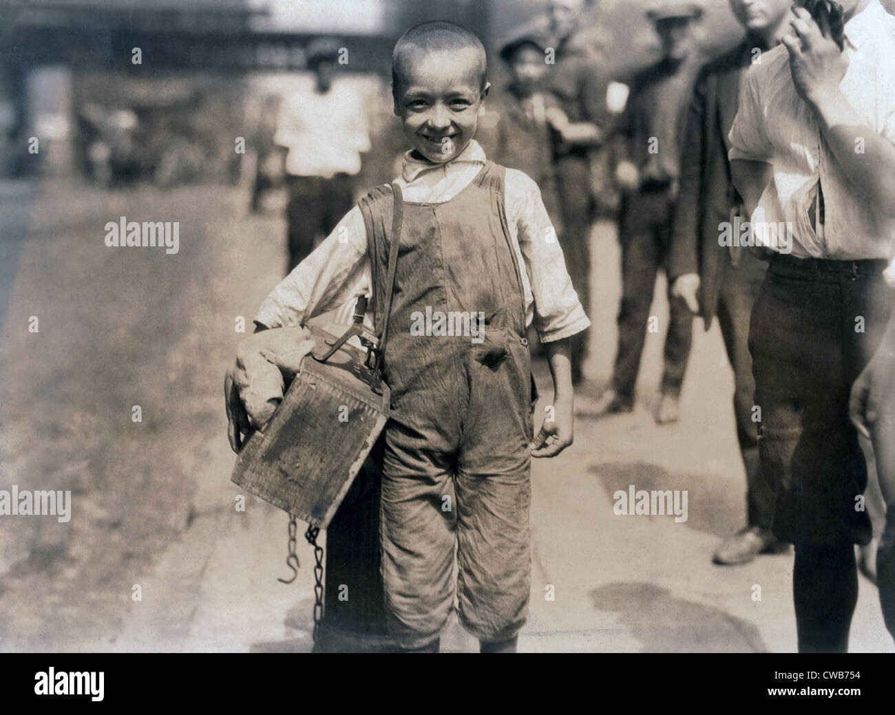 Child labor, Bootblack near Trinity Church, New York City. photograph by Lewis Wickes Hine, July, 1924 Stock Photo