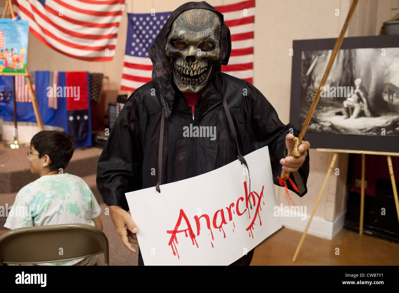 Volunteer dressed as ghoulish 'Anarchy' helps teach lesson on balancing tyranny and anarchy in order to achieve, sustain liberty Stock Photo