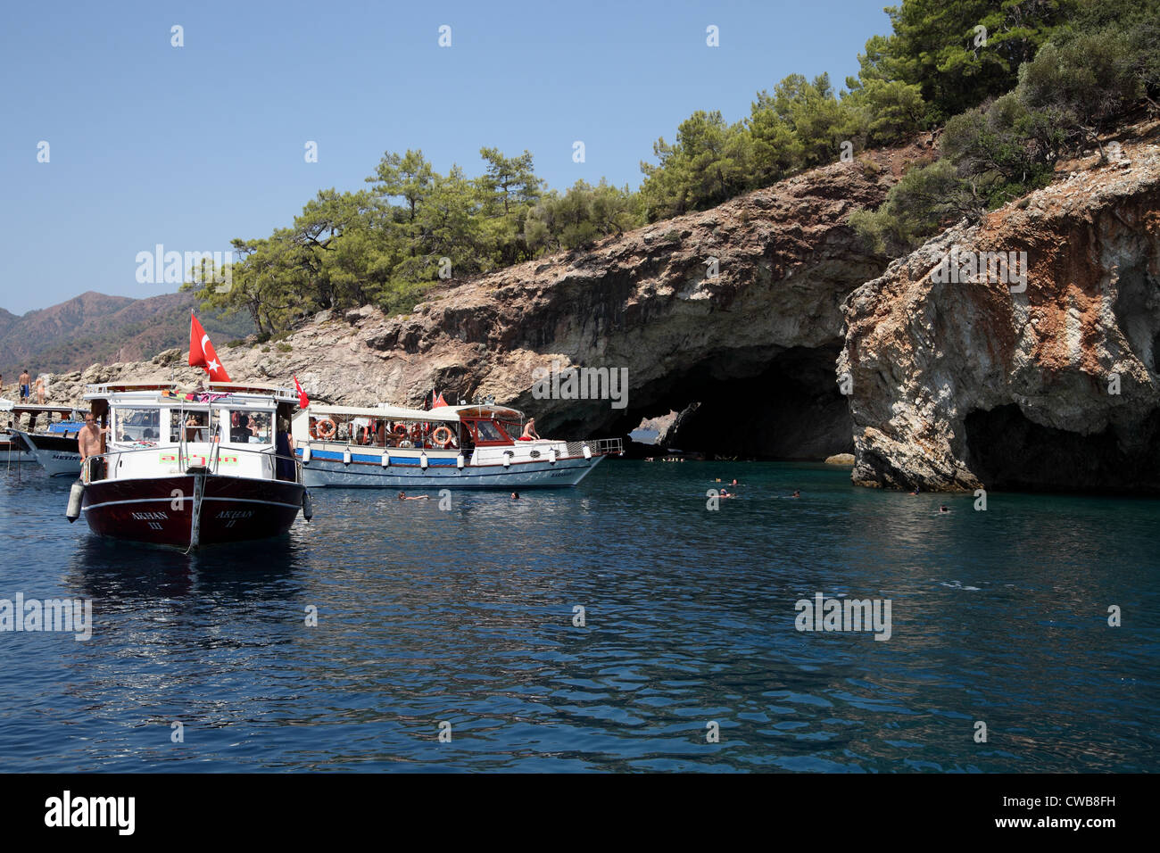 View of tourist boats near the Ekincik Caves, near to Iztuzu Beach, Dalyan, Turkey Stock Photo