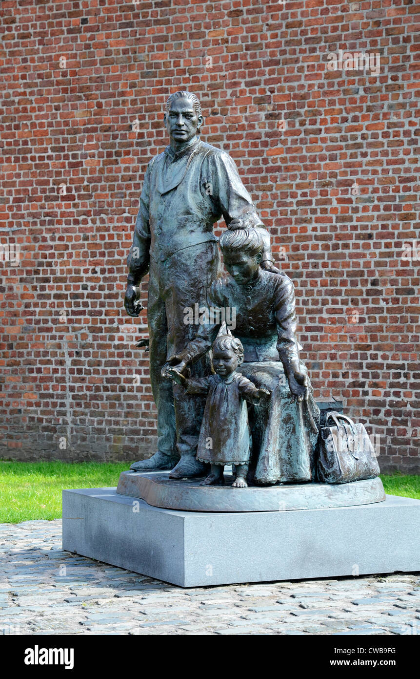 The ' Emigrants Statue '  by Mark De Graffenried  at the Albert Dock in Liverpool, UK Stock Photo