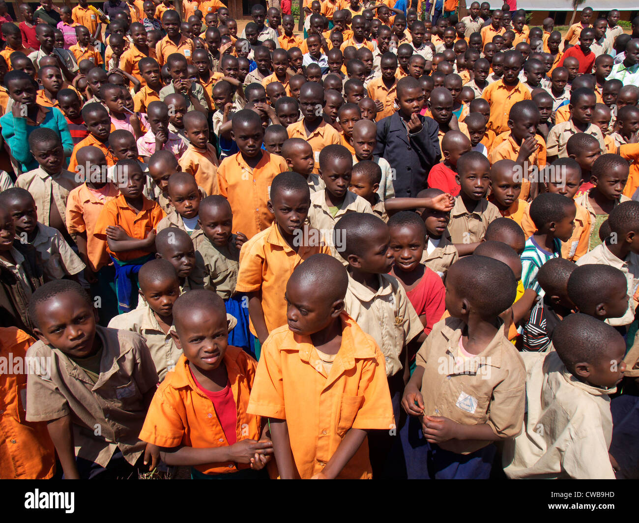 Rwandan school children stand in their playground waiting for instructions Stock Photo