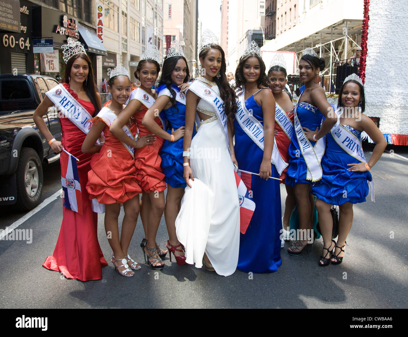 A group of young Dominican Princesses ready to ride a float up the Avenue of the Americas at the Dominican Day Parade in NYC Stock Photo