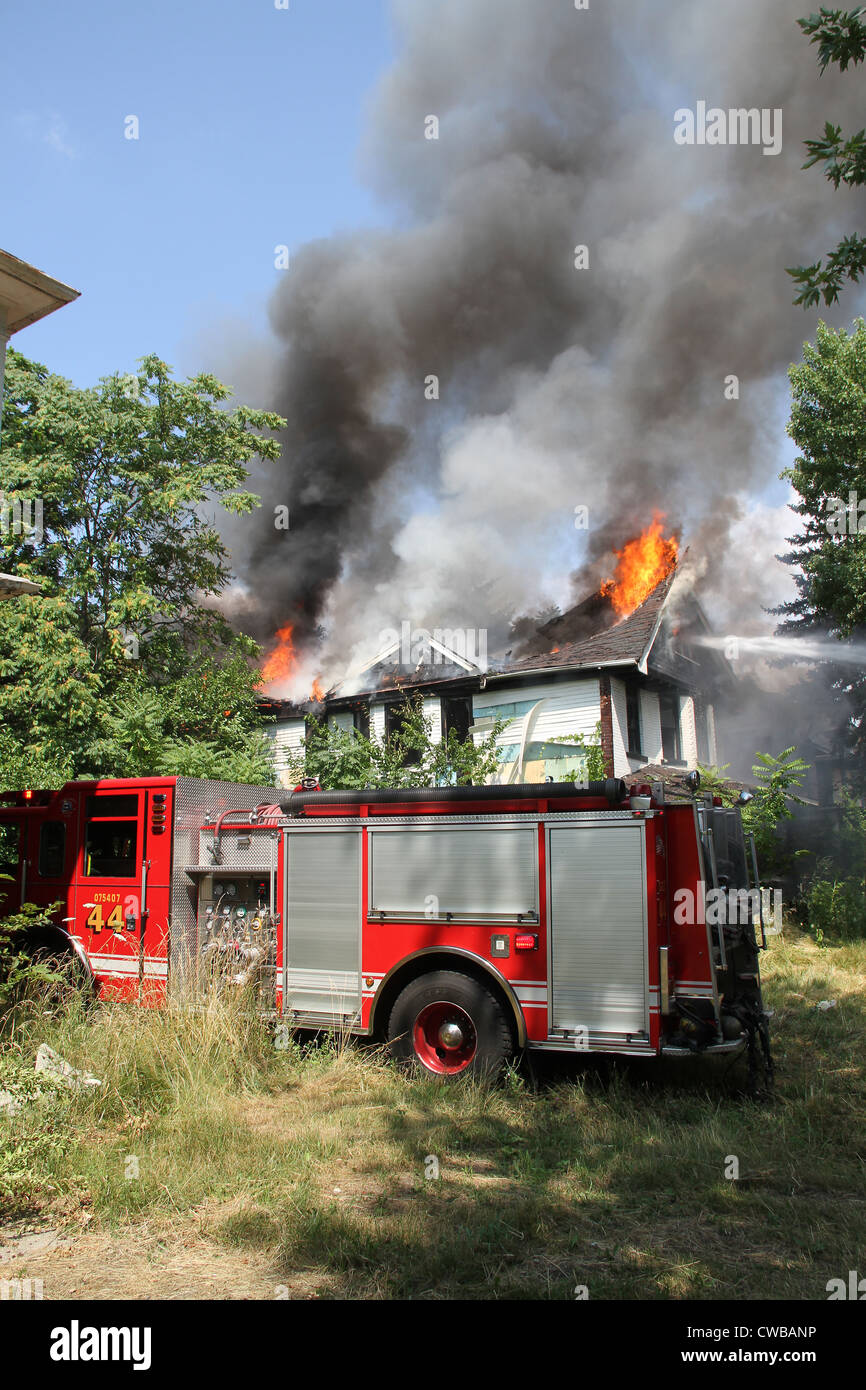 Detroit Fire department at scene of vacant dwelling fire Detroit Michigan USA Stock Photo