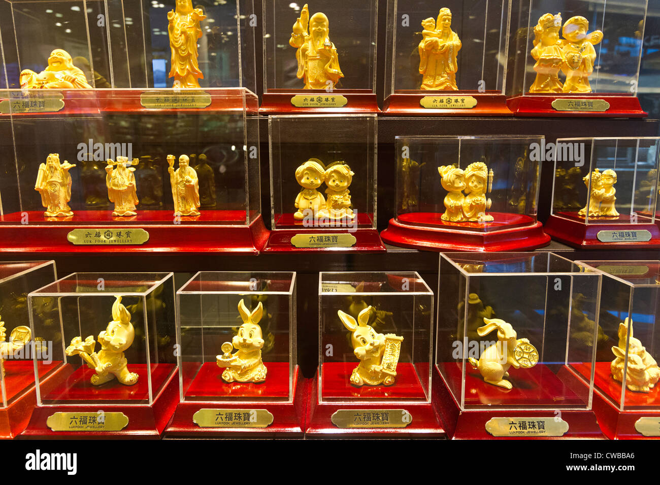 Gold plated good luck statues popular with Asians, on sale in a