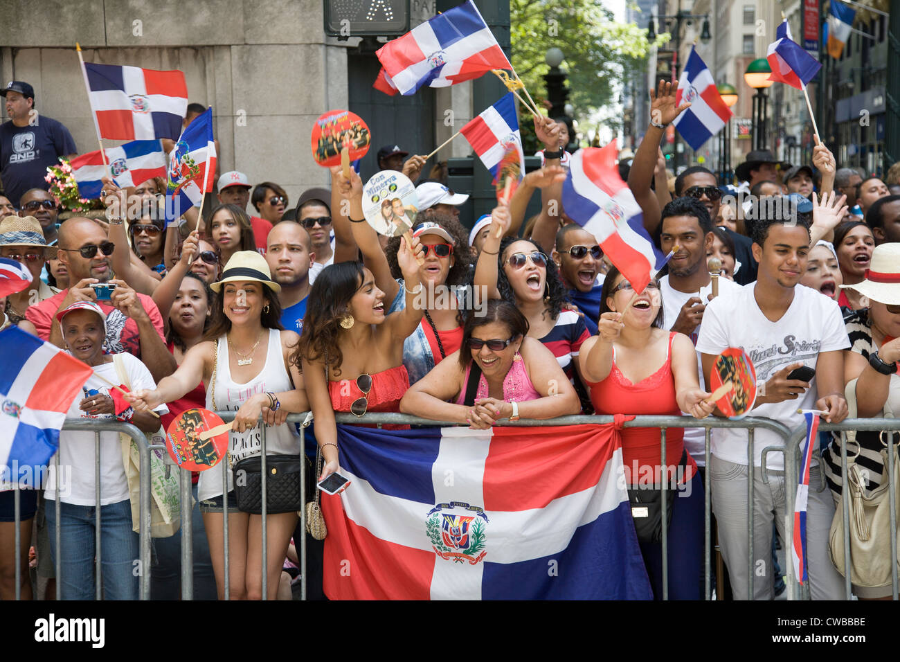 Dominican New Yorkers come out in large numbers to watch the Dominican Day Parade along Ave.of the Americas in New York City Stock Photo