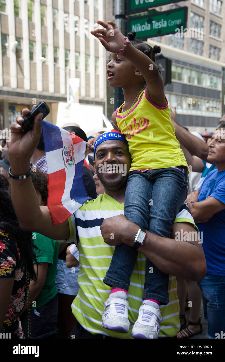 Father and daughter have a good time at the Dominican Day Parade in New