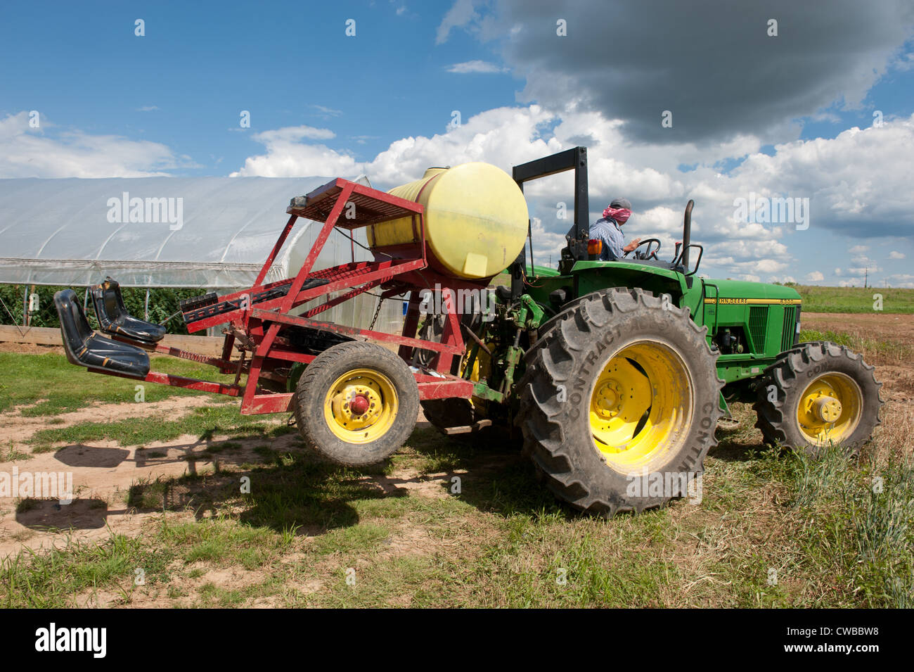 Tractor plowing farm field Stock Photo