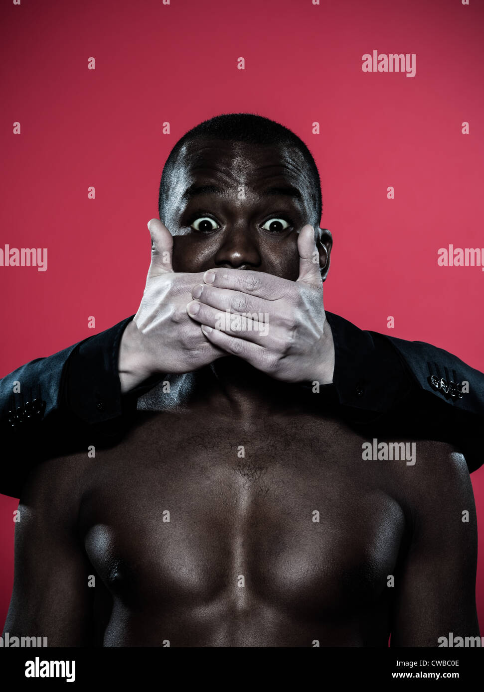 one african man hand on his mouth Freedom of speech concept Stock Photo