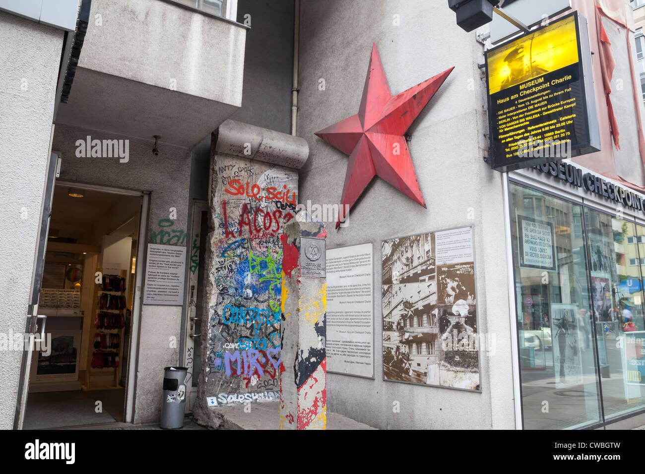 Section of Berlin Wall, Red Star and German border post at Checkpoint Charlie, Berlin, Germany Stock Photo