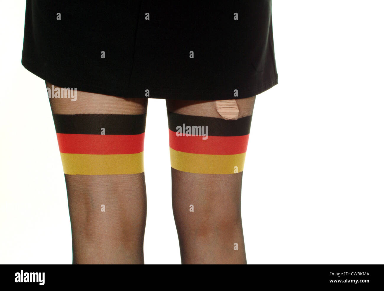 Berlin woman wears pantyhose with the Germany flag motif Stock Photo