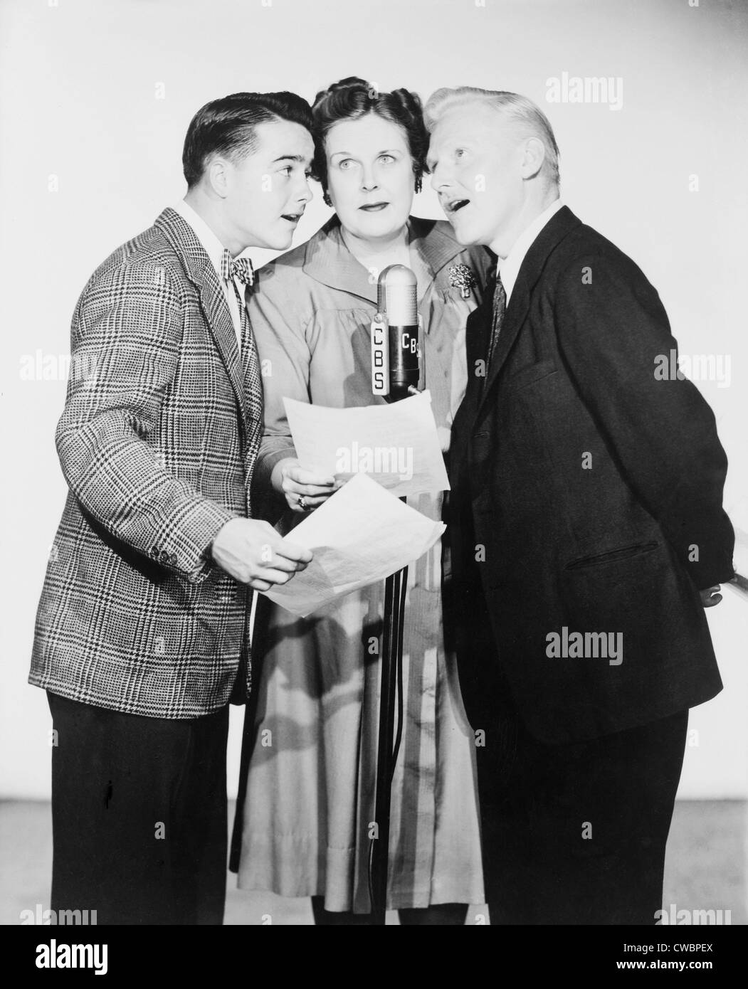 Dickie Jones (b.1927) at left, and other voice actors on the C.B.S. radio show THE ALDRITCH FAMILY (1938-1953), a popular radio Stock Photo