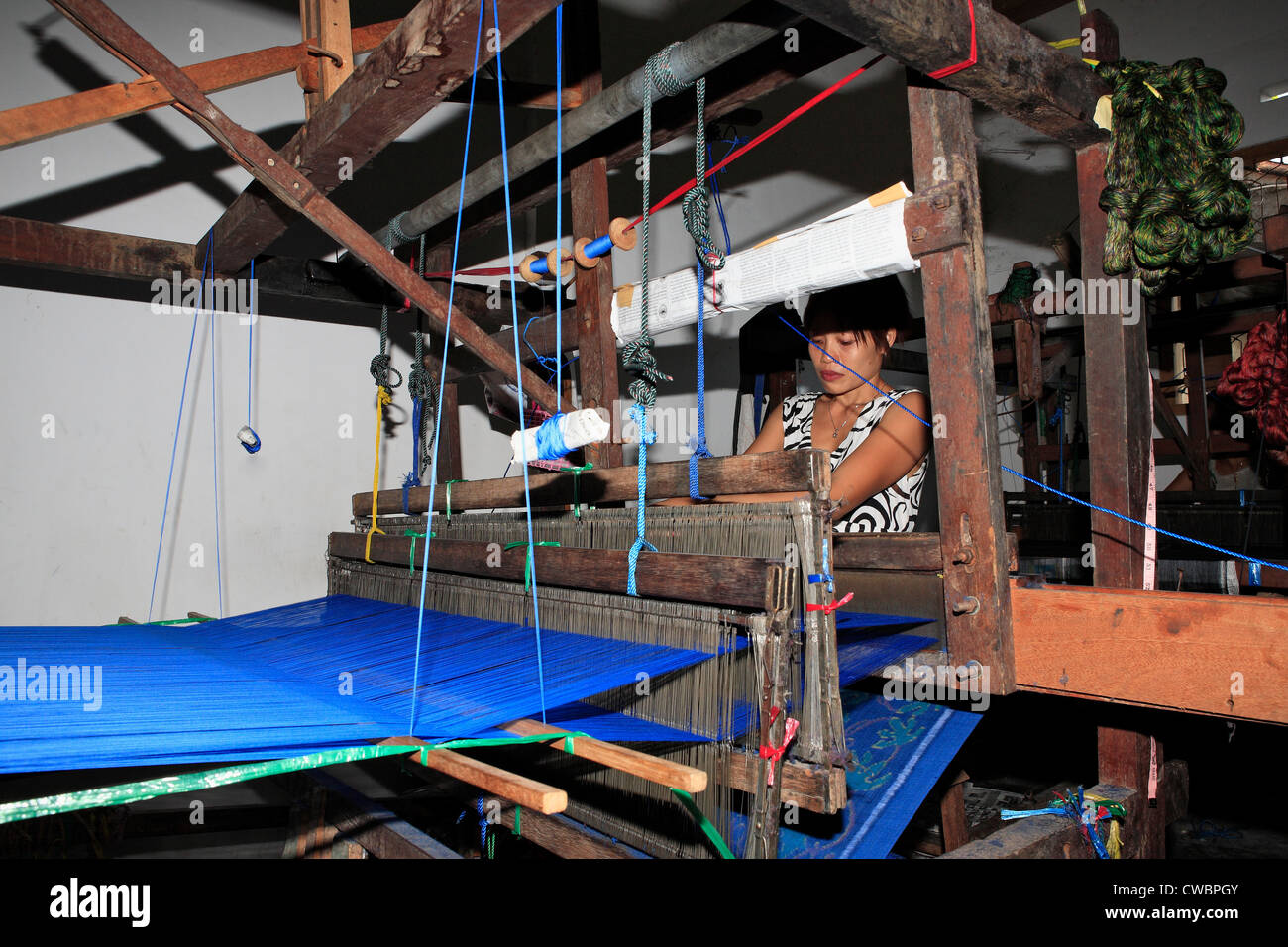 A process of Ikat fabric weaving. Weaving on a footloom Stock Photo Alamy