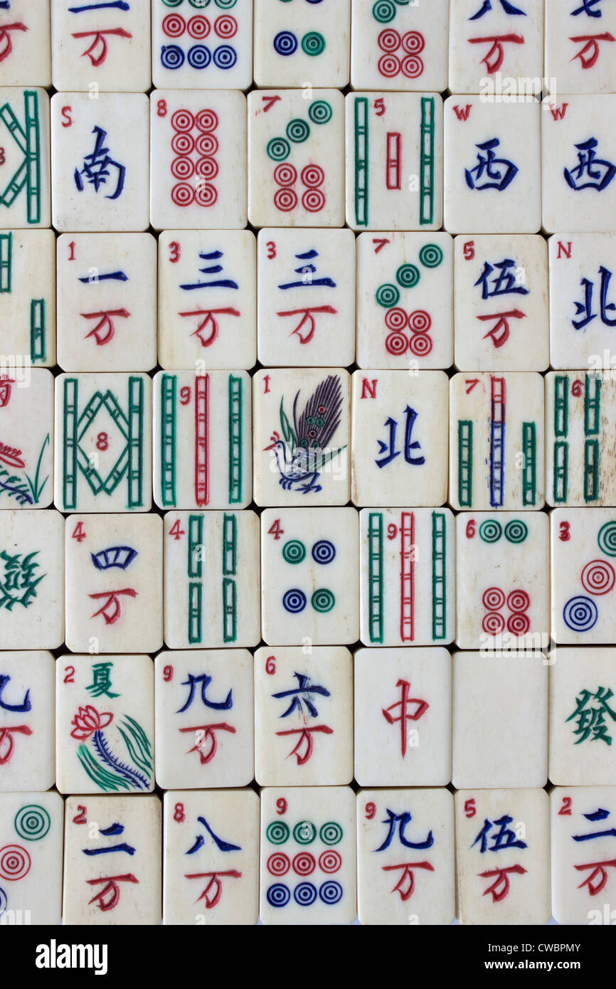 Solid ivory mahjong tiles, mid 20th century. The tiles were wrapped in  cellphone and unused as to their white appearance and…