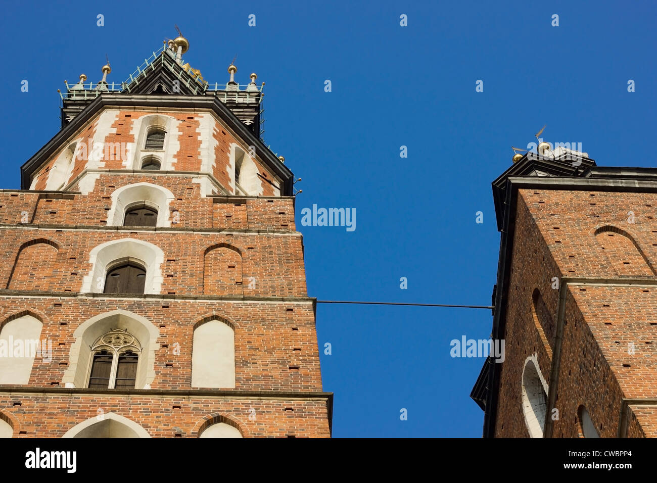 The towers of the Mariacki or Saint Mary's church in Krakow, Poland. Stock Photo
