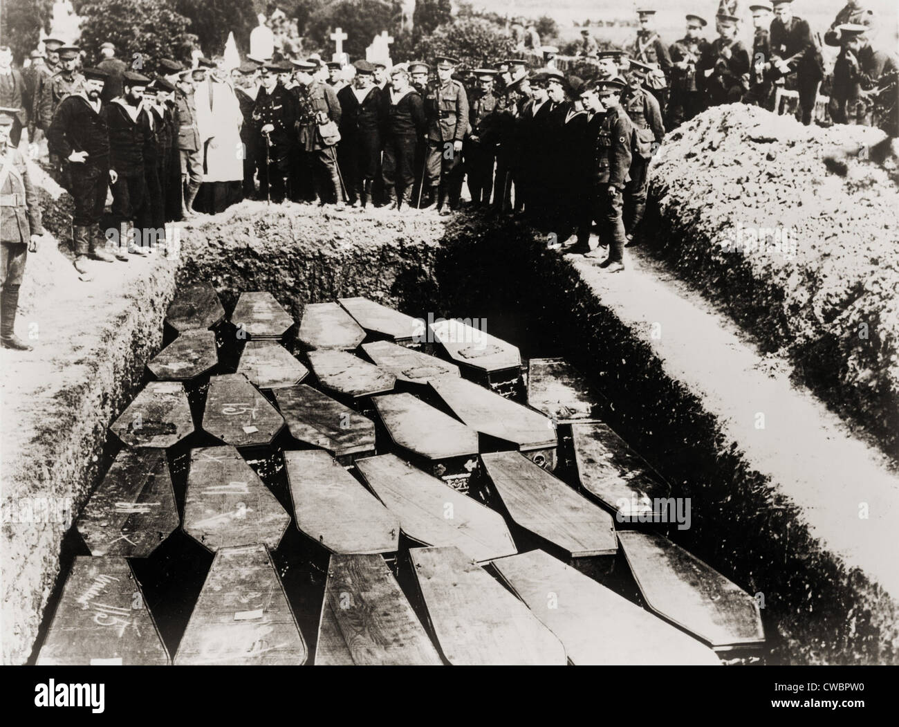 Clergy and military witness the common grave burial of Lusitania victims, in Ireland, after their recovery from sea. 1915. Stock Photo