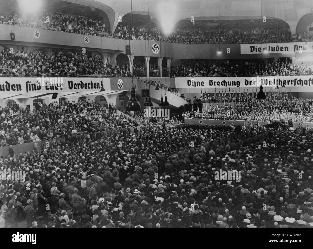 Anti-Semitic rally, with swastikas and anti-Semitic banners, at the massive auditorium of Sportpalast, Berlin, where Nazi Stock Photo