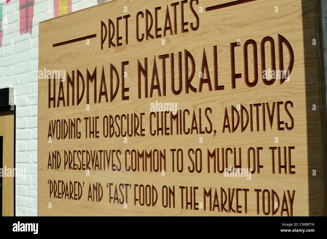 Sign outside Pret a Manger takeaway food outlet claiming their food is made with natural ingredients Stock Photo