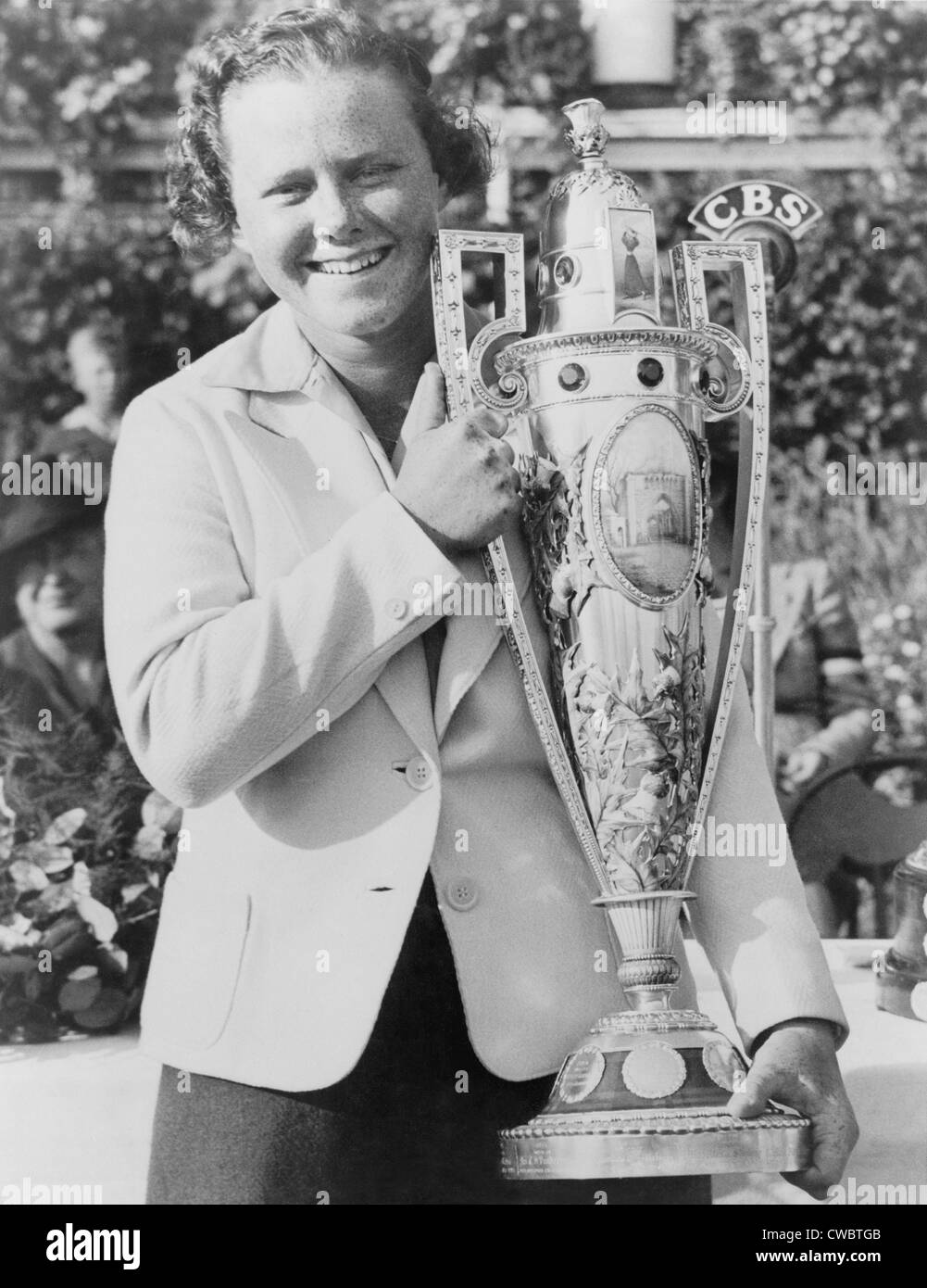 Patty Berg, (1918-2006), holds her trophy after winning the National Women's Golf Championship at the Westmoreland Country Stock Photo