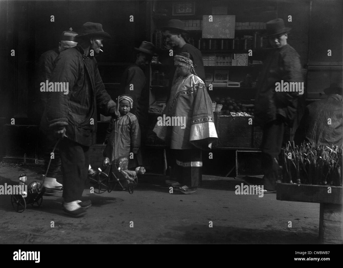 THE TOY PEDDLER. Chinese immigrants in San Francisco. From Arnold Genthe's CHINATOWN SERIES. Ca. 1896. Stock Photo