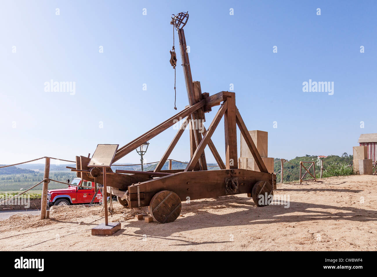 Medieval catapult replica in a reenactment of a Medieval Fair in Óbidos, Portugal. Stock Photo