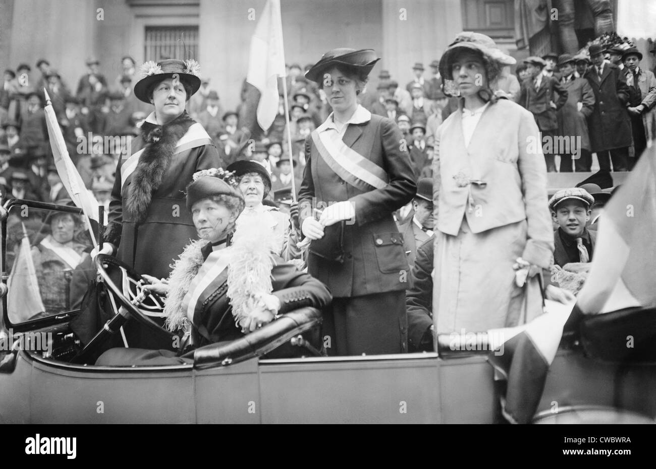Prominent woman's suffrage advocates parade in an open car supporting the ratification of the 19th amendment granting women the Stock Photo