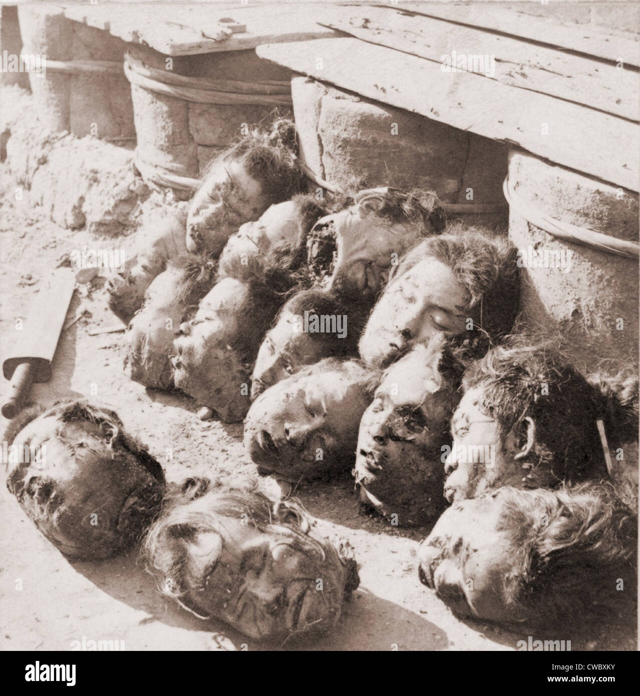 Heads of Chinese criminals scattered on the ground after their execution at Canton prison. Ca. 1901. Stock Photo