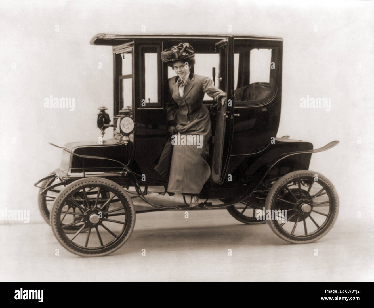 Women steps from an electric car. 1908. Stock Photo