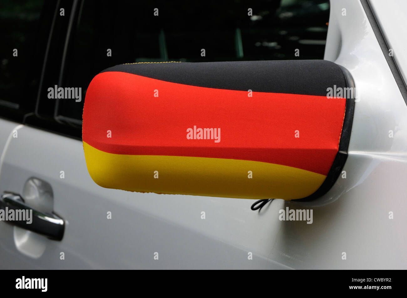 The colours of the German flag on a car wing mirror during Euro 2012, Frankfurt, Germany. Stock Photo