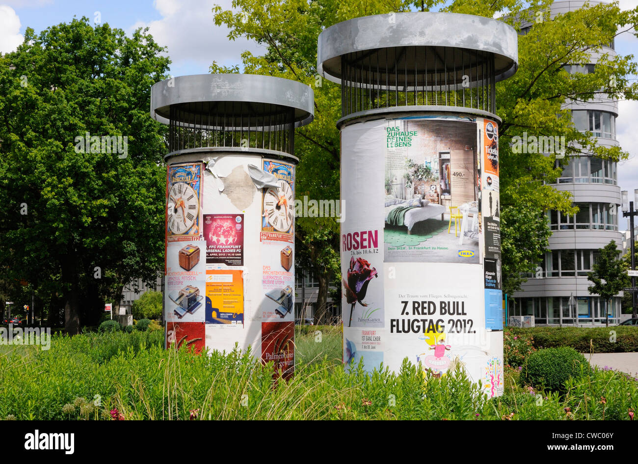 Advertising posters on U-bahn ventilation shafts, Frankfurt, Germany. Stock Photo