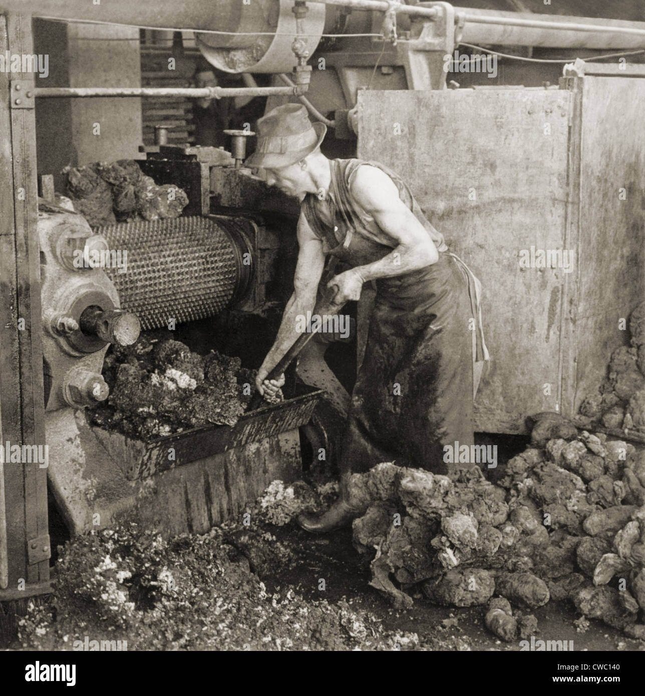 Crude rubber from Brazil in a rubber cracking machine, Goodyear Tire Factory, Akron, Ohio. 1928. Stock Photo