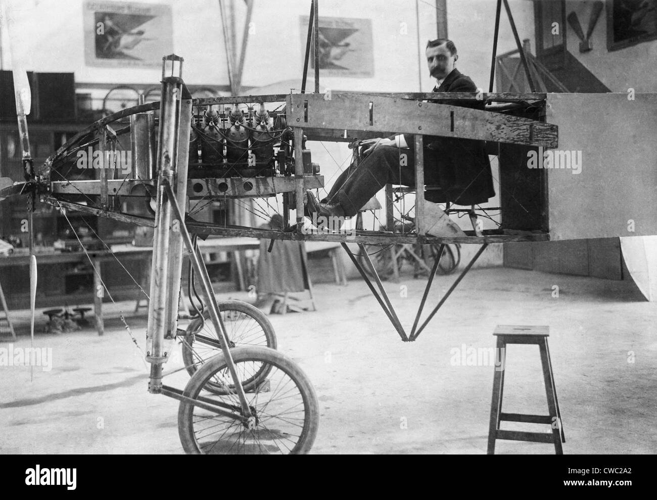 Louis Bleriot 1872-1936 seated in his 50 horse power mono-plane which is under construction in his workshop. LC-USZ62-107352 Stock Photo