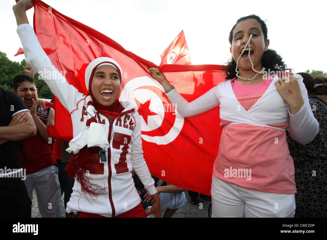 Soccer fans World Cup 2006: Cheering girl with Tunisian flag Stock Photo