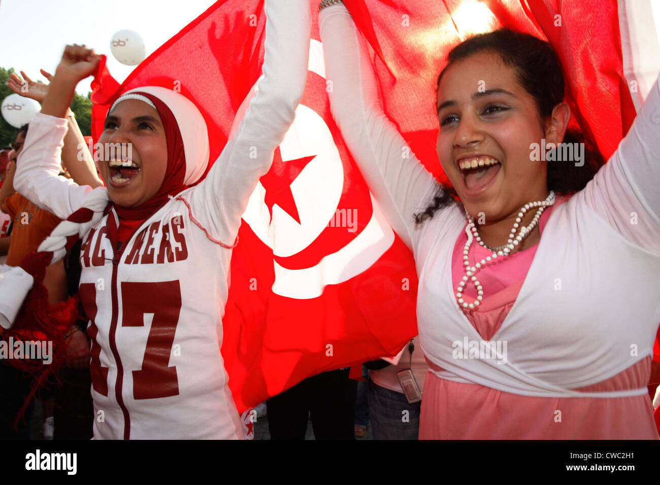 Soccer fans World Cup 2006: Cheering girl with Tunisian flag Stock Photo