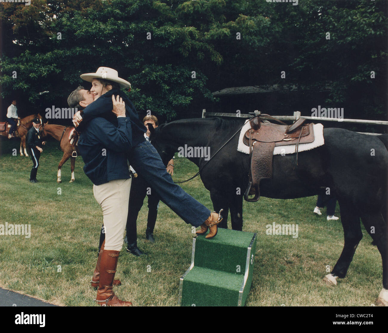 Ronald Reagan affectionately assists First Lady Nancy Reagan during horseback riding at the Maryland Presidential retreat Camp Stock Photo