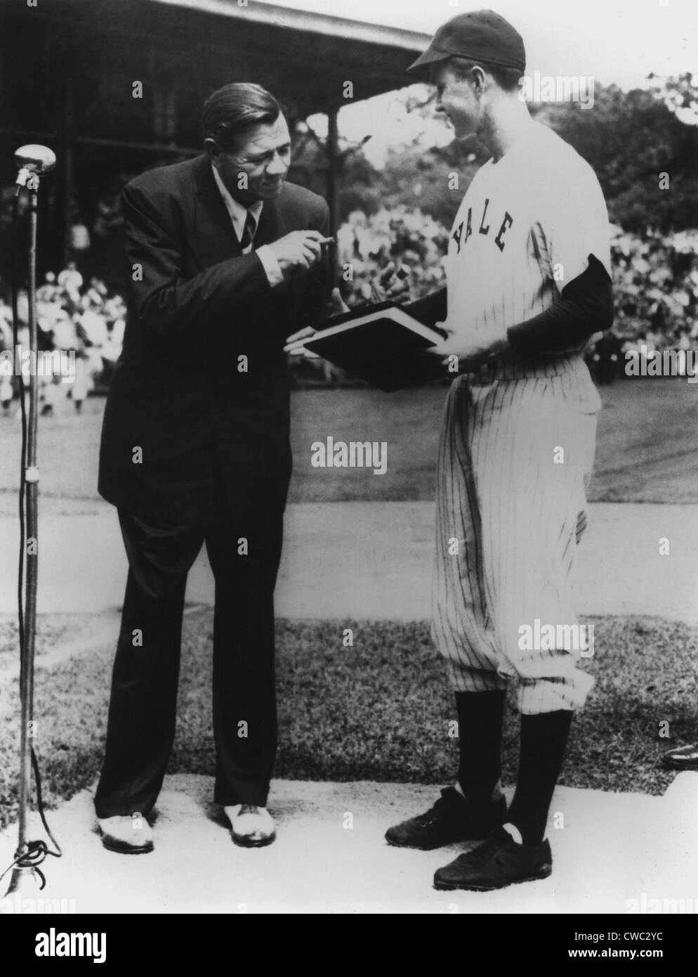 On behalf of Yale University Yale Baseball Captain George Bush accepts the manuscript of THE BABE RUTH STORY his autobiography Stock Photo
