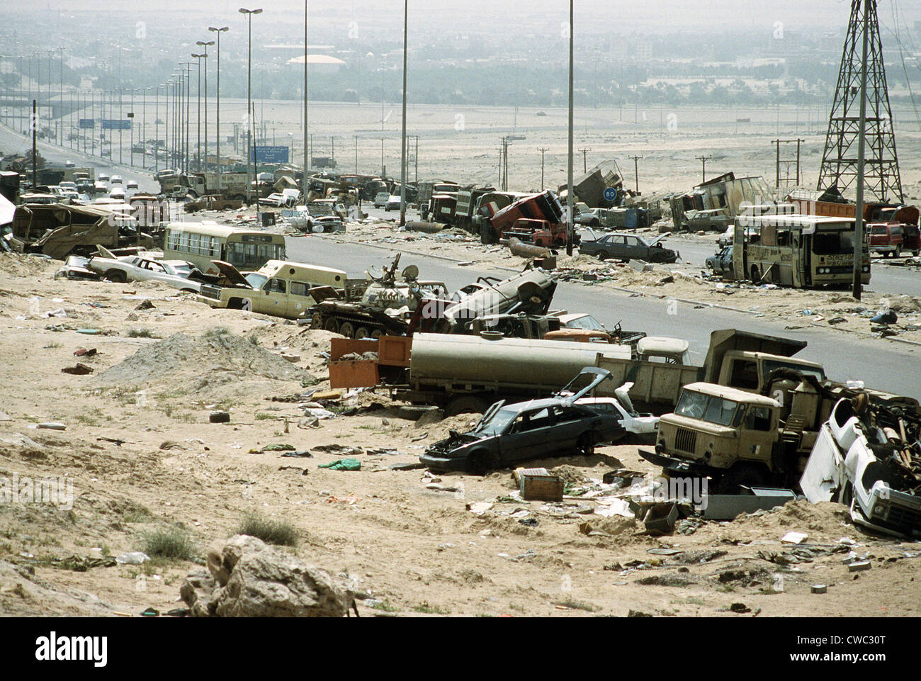Demolished vehicles line Highway 80 the 'Highway of Death' were destroyed as Iraqi forces retreated from Kuwait during Stock Photo